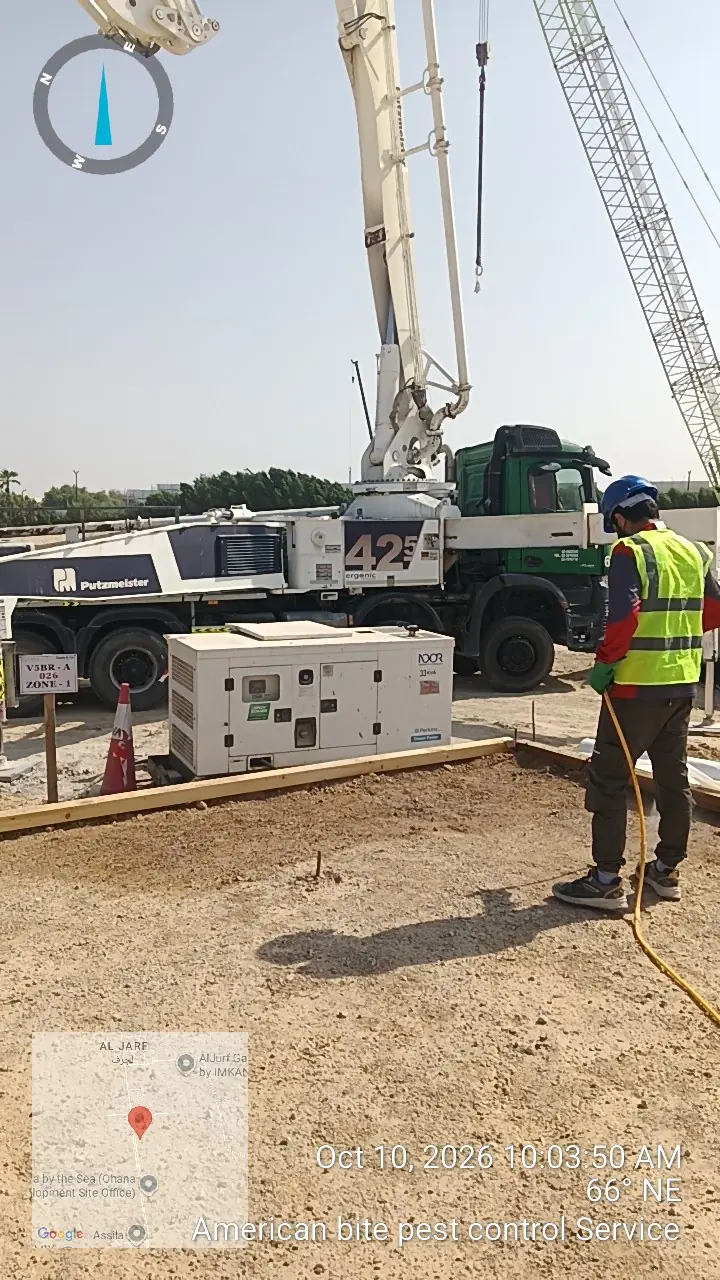 Technician applying anti-termite treatment to the plinth area of a new building in Al Jurf, Abu Dhabi