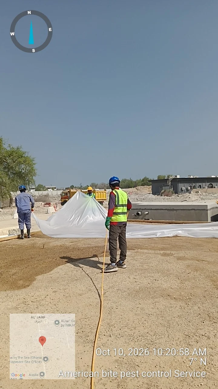 Polythene sheet being laid over termite treated plinth soil before the slab is poured at a site in Al Jurf, Abu Dhabi